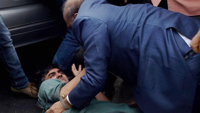 BJP MLA OP Sharma thrashing one of the JNU students who were protesting against the arrest of JNUSU President Kanhaiya Kumar during a clash between the advocates and the students outside the Patiala House Courts in New Delhi on Monday. (PTI) BJP MLA OP Sharma thrashing one of the JNU students who were protesting against the arrest of JNUSU President Kanhaiya Kumar during a clash between the advocates and the students outside the Patiala House Courts in New Delhi on Monday. (PTI)