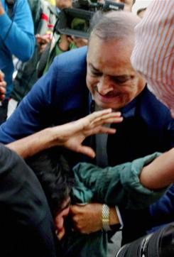 BJP MLA OP Sharma thrashing one of the JNU students who were protesting against the arrest of JNUSU President Kanhaiya Kumar during a clash between the advocates and the students outside the Patiala House Courts in New Delhi (PTI) BJP MLA OP Sharma thrashing one of the JNU students who were protesting against the arrest of JNUSU President Kanhaiya Kumar during a clash between the advocates and the students outside the Patiala House Courts in New Delhi (PTI)