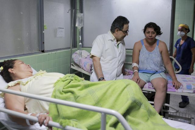Neurologist Jairo Lizarazo talks to his patient Daysi Mendoza who's recovering from Guillain-Barre syndrome. According to the Health Institute of Norte de Santander state, 30 cases of Guillain-Barre Syndrome were diagnosed in the state since a Zika outbreak, a 10-time increase in the state's yearly average. (AP Photo) Neurologist Jairo Lizarazo talks to his patient Daysi Mendoza who's recovering from Guillain-Barre syndrome. According to the Health Institute of Norte de Santander state, 30 cases of Guillain-Barre Syndrome were diagnosed in the state since a Zika outbreak, a 10-time increase in the state's yearly average. (AP Photo)