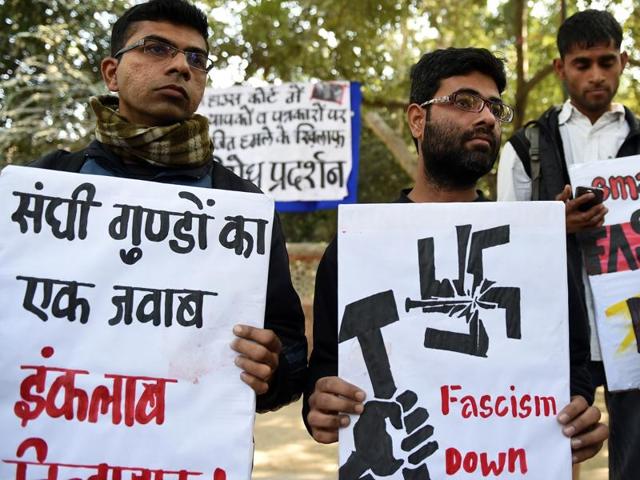 Indian activists of the DISHA Students Organistion hold placards against the February 15, 2016 attack on JNU students and teachers at Patiala House court, during a protest in New Delhi on February 16, 2016.(AFP) Indian activists of the DISHA Students Organistion hold placards against the February 15, 2016 attack on JNU students and teachers at Patiala House court, during a protest in New Delhi on February 16, 2016.(AFP)