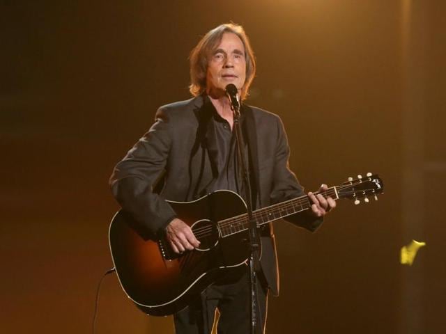 Jackson Browne performs Take It Easy during a tribute to Glenn Frey at the 58th annual Grammy Awards. (Matt Sayles/Invision/AP) 