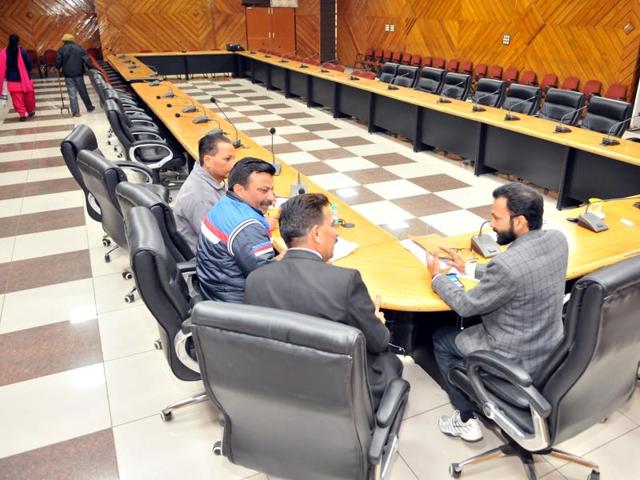 Official of the district administration waiting for the representatives of private schools in a meeting hall in Jalandhar on Monday. (HT Photo) Official of the district administration waiting for the representatives of private schools in a meeting hall in Jalandhar on Monday. (HT Photo)