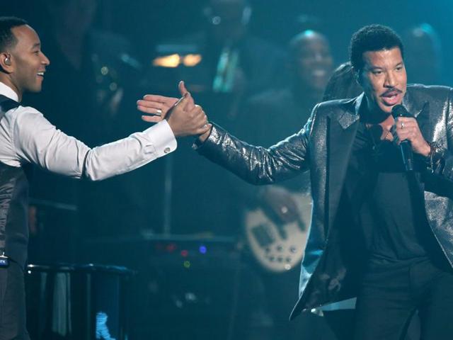 John Legend, left, and Lionel Richie perform during a tribute in his honor at the 58th annual Grammy Awards. (Matt Sayles/Invision/AP) 