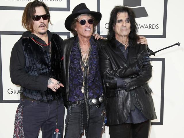 BAD: Johnny Depp thinks that outfit makes for red carpet appearance. We are just worried sick what he would wear to Oscars! Pictured here with Joe Perry and Alice Cooper. (REUTERS) 