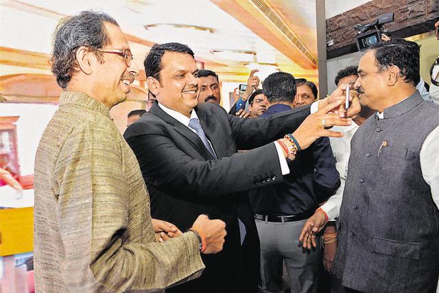 Devendra Fadnavis and Uddhav Thackeray take a selfie on Monday. (PTI)