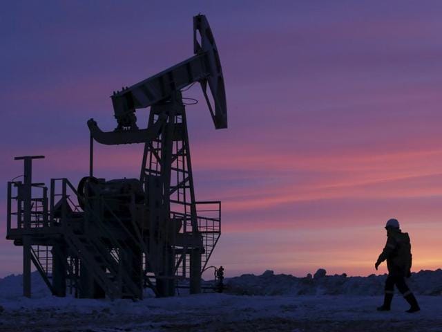 A worker walks past a pump jack on an oil field owned by Bashneft company near the village of Nikolo-Berezovka, northwest from Ufa, Bashkortostan in Russia(Reuters File) A worker walks past a pump jack on an oil field owned by Bashneft company near the village of Nikolo-Berezovka, northwest from Ufa, Bashkortostan in Russia(Reuters File)