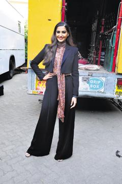 Sonam Kapoor makes a pretty picture in black flared pants. (Viral Bhayani)
