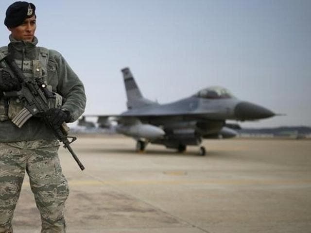 A US soldier stands guard in front of a F-16 fighter jet. India had expressed displeasure over the Obama administration’s decision to sell these nuclear-capable jets to Pakistan. (Reuters Photo) A US soldier stands guard in front of a F-16 fighter jet. India had expressed displeasure over the Obama administration’s decision to sell these nuclear-capable jets to Pakistan. (Reuters Photo)