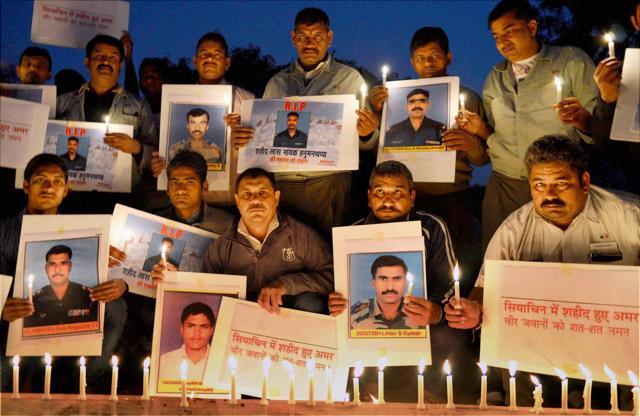 A group of social activist pay their homage to Lance Naik Hanamanthappa Koppad. (PTI) A group of social activist pay their homage to Lance Naik Hanamanthappa Koppad. (PTI)