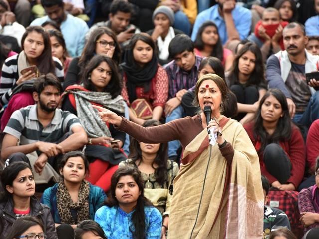 Brinda Karat with JNU students as they protest against the arrest of Kanhaiya Kumar at JNU campus on Wednesday. (Sushil Kumar/HT)