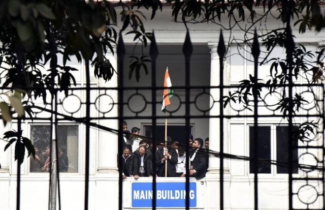 Lawyers raise Indian flag and shout slogans at Patiala House. (Photo by Virender Singh Gosain/ Hindustan Times) Lawyers raise Indian flag and shout slogans at Patiala House. (Photo by Virender Singh Gosain/ Hindustan Times)