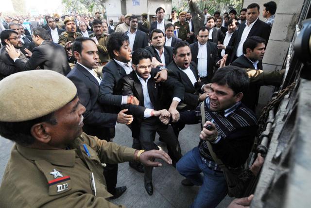 Lawyers assaulting a journalist outside Patiala House Courts in New Delhi on Wednesday. (HT Photo) Lawyers assaulting a journalist outside Patiala House Courts in New Delhi on Wednesday. (HT Photo)