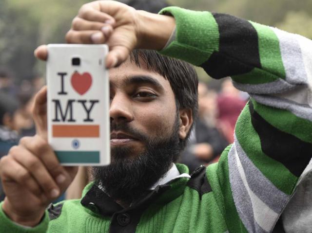 A JNU students takes a photo from his mobile phone during a march in support of JNUSU president Kanhaiya Kumar. (Vipin Kumar/HT Photo) A JNU students takes a photo from his mobile phone during a march in support of JNUSU president Kanhaiya Kumar. (Vipin Kumar/HT Photo)