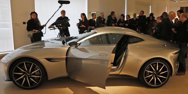 The James Bond Aston Martin of the latest Spectre movie is surrounded by people at the auction house Christie's in London. (AP) The James Bond Aston Martin of the latest Spectre movie is surrounded by people at the auction house Christie's in London. (AP)