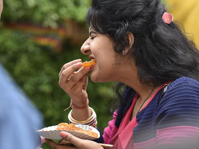 We all want to be this woman.  Those hot jalebis have our mouth watering? What about you? (Raj K Raj / HT Photo) 