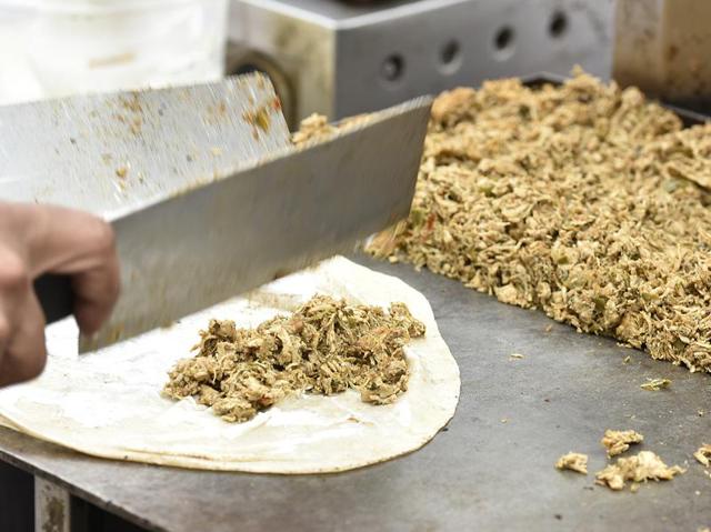 A chef preparing chicken roll during the Delhi Street Food Festival at Baba Kharak Singh Marg, near Connaught Place, New Delhi. (Raj K Raj / HT Photo) 