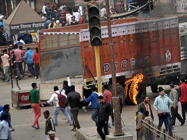 Rohtak remained under siege for the sixth day as protests turned progressively more violent with a counter-protest erupting against the Jats, essentially dividing the city into two parts — while Jats controlled areas from Delhi Road to Subhash Chowk, the other communities took control between Chhotu Ram Chowk and Hisar Road. (AP)