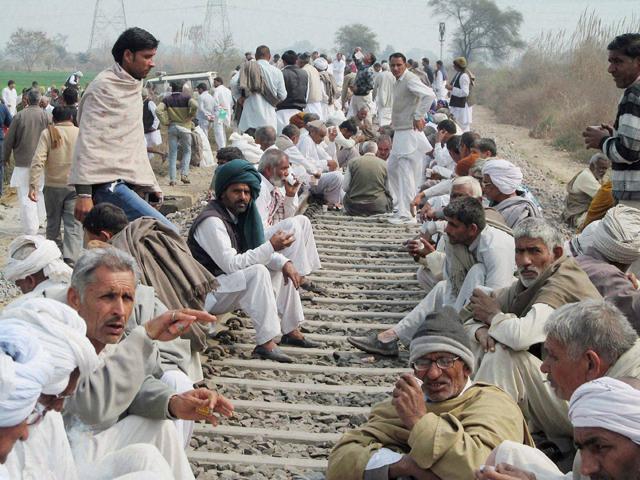 Jat community members blocked railway tracks during their agitation, in Hisar. (PTI Photo) Jat community members blocked railway tracks during their agitation, in Hisar. (PTI Photo)