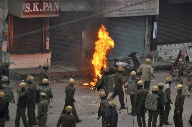 Police arrive at the site after Jat community members torched a motorcyle during their agitation, in Rohtak. (PTI Photo) Police arrive at the site after Jat community members torched a motorcyle during their agitation, in Rohtak. (PTI Photo)