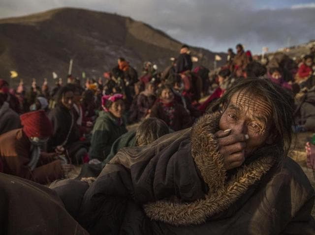In this image released by World Press Photo titled ‘Bliss Dharma Assembly’ by photographer Kevin Frayer for Getty Images which won second prize in the Daily Life stories category shows Tibetan Buddhist nomads listening during the annual Bliss Dharma Assembly in Sertar county, Garze Tibetan Autonomous Prefecture, Sichuan province, China, Oct. 31, 2015. (Kevin Frayer/Getty Images, World Press Photo via AP) (Kevin Frayer/ Getty Images/ AP) In this image released by World Press Photo titled ‘Bliss Dharma Assembly’ by photographer Kevin Frayer for Getty Images which won second prize in the Daily Life stories category shows Tibetan Buddhist nomads listening during the annual Bliss Dharma Assembly in Sertar county, Garze Tibetan Autonomous Prefecture, Sichuan province, China, Oct. 31, 2015. (Kevin Frayer/Getty Images, World Press Photo via AP) (Kevin Frayer/ Getty Images/ AP)