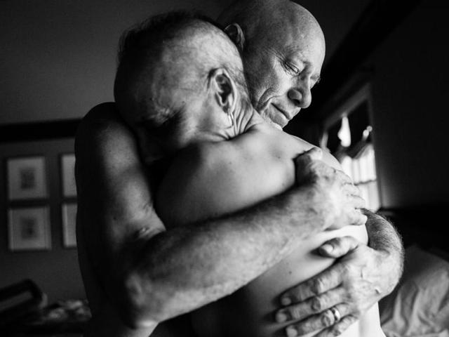 In this image released by World Press Photo titled "A Life in Death" by photographer Nacy Borowick which won second prize Long Term Projects shows Howie and Laurel Borowick embrace in the bedroom of their home. In their 34- year marriage, they were diagnosed with stage-four cancer at the same time. New York, USA, March 8, 2013. (Nancy Borowick, World Press Photo via AP) (AP) In this image released by World Press Photo titled "A Life in Death" by photographer Nacy Borowick which won second prize Long Term Projects shows Howie and Laurel Borowick embrace in the bedroom of their home. In their 34- year marriage, they were diagnosed with stage-four cancer at the same time. New York, USA, March 8, 2013. (Nancy Borowick, World Press Photo via AP) (AP)