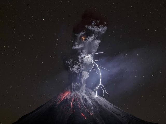 In this image released by World Press Photo titled "The Power of Nature" by photographer Sergio Tapiro which won the third prize in the Nature Singles category shows a powerful night explosion of the Colima Volcano with lightning, ballistic projectiles and incandescent rockfalls, Comala municipality in Colima, Mexico, 13 December 2015. (Sergio Tapiro, World Press Photo via AP) (AP) In this image released by World Press Photo titled "The Power of Nature" by photographer Sergio Tapiro which won the third prize in the Nature Singles category shows a powerful night explosion of the Colima Volcano with lightning, ballistic projectiles and incandescent rockfalls, Comala municipality in Colima, Mexico, 13 December 2015. (Sergio Tapiro, World Press Photo via AP) (AP)
