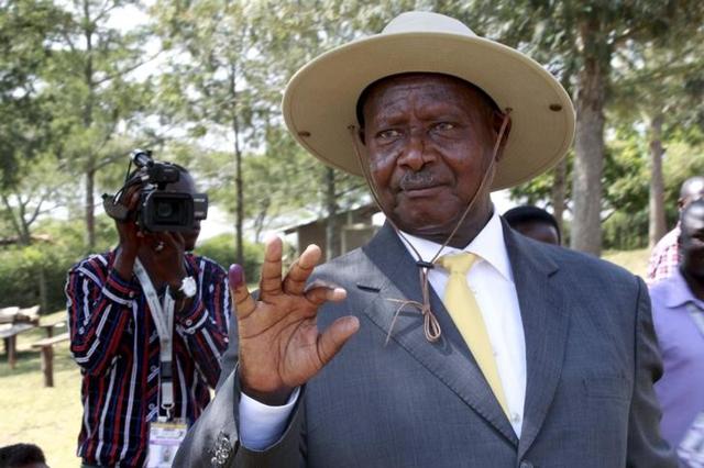 Uganda's incumbent President Yoweri Museveni displays his inked finger after casting his vote at a polling station during the presidential elections in Kirihura in western Uganda. (REUTERS)