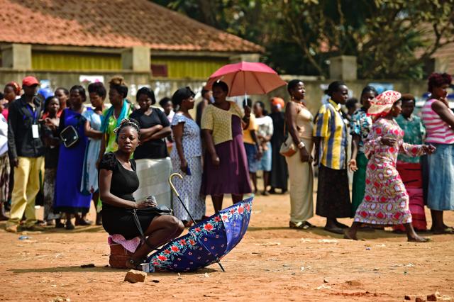 In the capital Kampala, Thursday's elections were disrupted by the late arrival of polling materials, angry demonstrations by frustrated voters, police use of tear gas and the brief arrest of an opposition candidate. (AFP Photo)