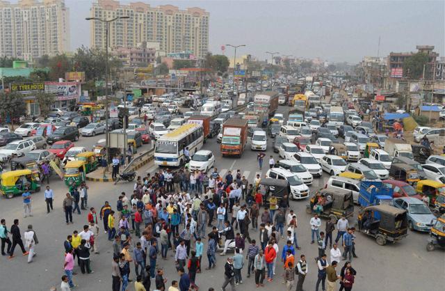 Protesters block the Gurgaon- Alwar National Highway near Netaji Subhash Chandra Bose Chowk in Gurgaon during their agitation. (PTI) Protesters block the Gurgaon- Alwar National Highway near Netaji Subhash Chandra Bose Chowk in Gurgaon during their agitation. (PTI)