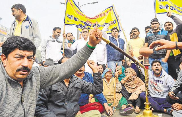 Members of ‘Jat aarakshan aandolan sangharsh samiti’ blocked the railway road during the protest for Jat Reservation. (Parveen Kumar/HT Photo) Members of ‘Jat aarakshan aandolan sangharsh samiti’ blocked the railway road during the protest for Jat Reservation. (Parveen Kumar/HT Photo)
