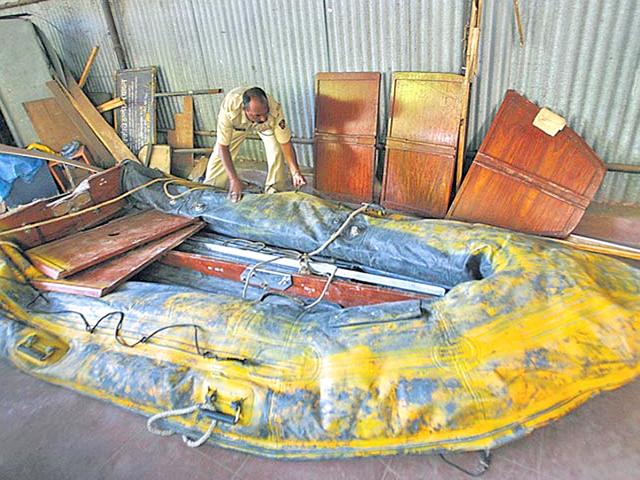 A cop checks out MV Kuber, the fishing vessel hijacked by Ajmal Kasab & his companions to bring them to Mumbai. (HT File Photo) A cop checks out MV Kuber, the fishing vessel hijacked by Ajmal Kasab & his companions to bring them to Mumbai. (HT File Photo)