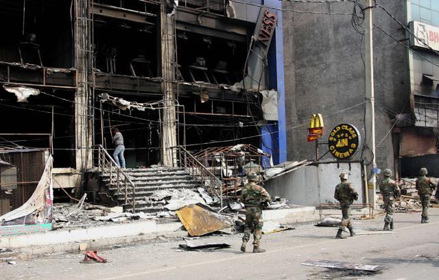 Shops have been burnt down and departmental stores have also been shut, causing problems to residents. (AFP) Shops have been burnt down and departmental stores have also been shut, causing problems to residents. (AFP)