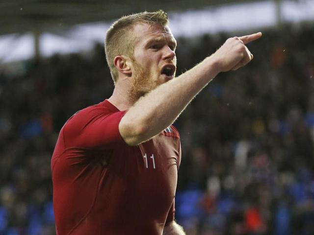 West Brom's Chris Brunt reacts after a coin is thrown at him from the crowd. (Reuters Photo) West Brom's Chris Brunt reacts after a coin is thrown at him from the crowd. (Reuters Photo)