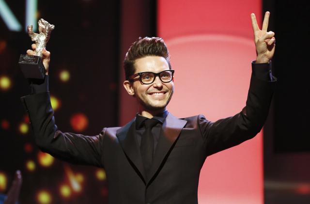 Tomasz Wasilewski holds up the Silver Bear award for the best script for his film United States of Love during the awards ceremony of the 66th Berlinale International Film Festival in Berlin. (REUTERS) Tomasz Wasilewski holds up the Silver Bear award for the best script for his film United States of Love during the awards ceremony of the 66th Berlinale International Film Festival in Berlin. (REUTERS)