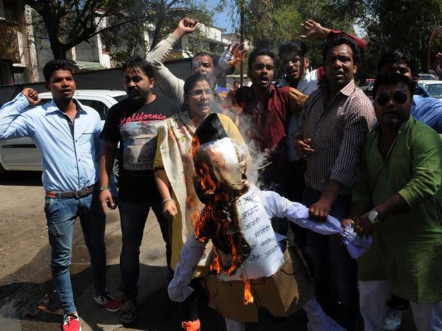 Congress workers burn the effigy of RSS chief Mohan Bhagwat in Bhopal on Monday. (Praveen Bajpai/ HT photo) Congress workers burn the effigy of RSS chief Mohan Bhagwat in Bhopal on Monday. (Praveen Bajpai/ HT photo)