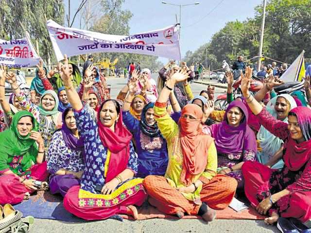 Despite Section 144 of the CrPC being imposed in Gurgaon, protesters demanding reservation for Jats continued to obstruct major roads and railway tracks on Sunday.(Parveen Kumar/HT Photo)