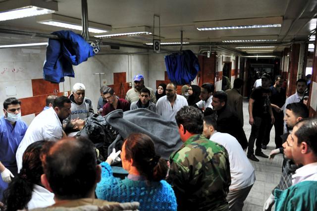 An injured woman receives treatment inside a hospital after multiple bomb blasts hit the southern district of Damascus, Syria, in this handout picture provided by SANA. (Reuters Photo) An injured woman receives treatment inside a hospital after multiple bomb blasts hit the southern district of Damascus, Syria, in this handout picture provided by SANA. (Reuters Photo)