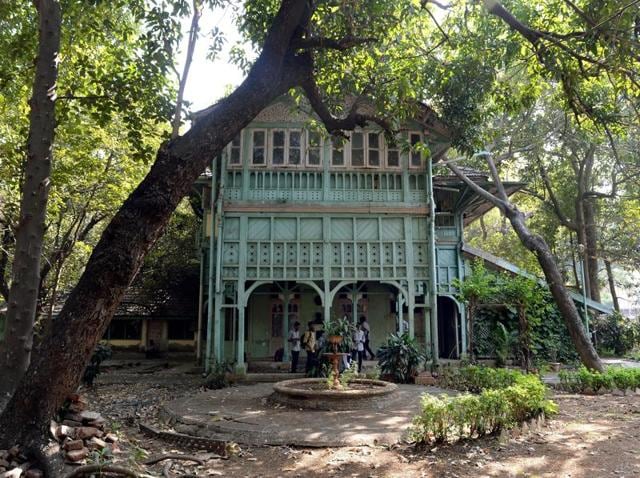 Students gather under the porch of the Kipling Bunglow - the birthplace of author Rudyard Kipling - inside the campus of the JJ School of Art in Mumbai.(AFP)