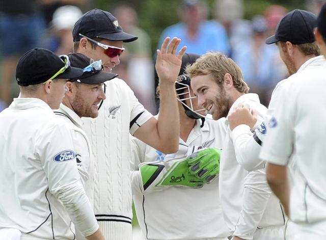 New Zealand’s Kane Williamson, center right, celebrates with team mates after dismissing Australia’s Nathan Lyon for 33 on the third day of the second international cricket test match at Hagley Park Oval. (AP Photo) New Zealand’s Kane Williamson, center right, celebrates with team mates after dismissing Australia’s Nathan Lyon for 33 on the third day of the second international cricket test match at Hagley Park Oval. (AP Photo)