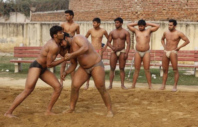 Wrestlers practising in an akhara in Asola. Apart from keeping alive the age-old traditional sport, wrestling has also become a way for youngster in Asola village to share screen space with Bollywood stars. (Sanchit Khanna/HT photo) Wrestlers practising in an akhara in Asola. Apart from keeping alive the age-old traditional sport, wrestling has also become a way for youngster in Asola village to share screen space with Bollywood stars. (Sanchit Khanna/HT photo)