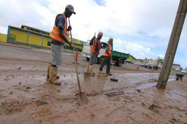 Suva City Council workers clean up mud from Grantham Road in the Raiwaqa suburb of Fiji's capital Suva, as a cleanup continues in the wake of Cyclone Winston. (Reuters Photo)