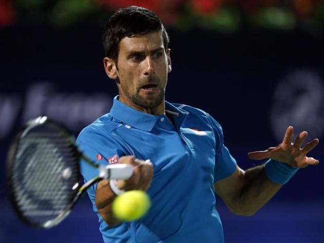 Novak Djokovic returns the ball to Tommy Robredo during their ATP tennis match. (Reuters Photo)