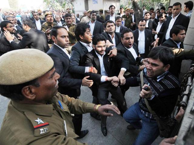 Lawyers assault a journalist outside Patiala House Court in New Delhi. (HT Photo) Lawyers assault a journalist outside Patiala House Court in New Delhi. (HT Photo)