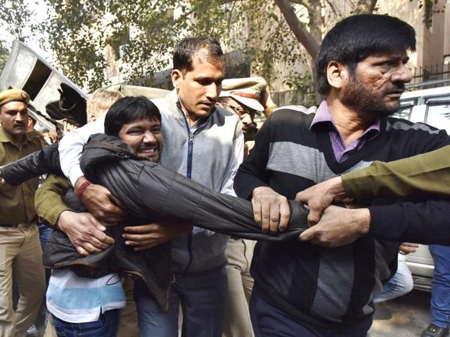 JNU students’ union president Kanhaiya Kumar (centre), is escorted by police outside the Patiala House court in New Delhi last week.(Reuters)