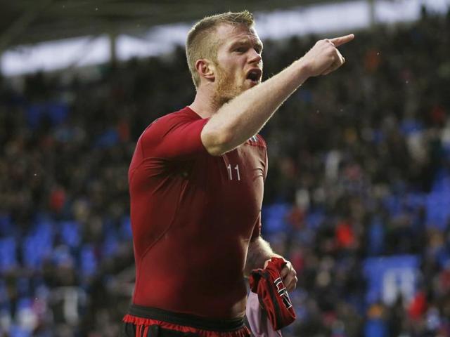 West Brom's Chris Brunt reacts after a coin is thrown at him from the crowd. (Reuters Photo) West Brom's Chris Brunt reacts after a coin is thrown at him from the crowd. (Reuters Photo)