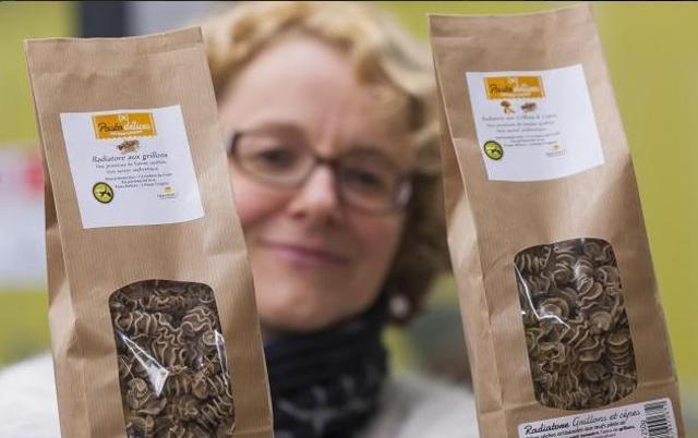 Director of the factory ‘L’Atelier a pates’ (’The pasta shop’) Stephanie Richard holds two pasta packages made with spelt flour and insects flour (locusts or crickets) on February 8, 2016 in Thiefosse, eastern France. (AFP)