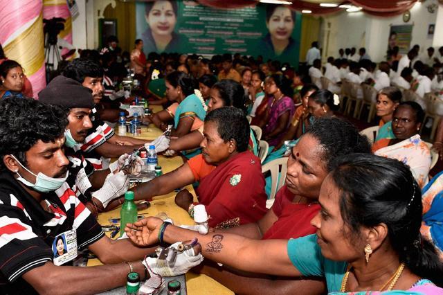 Giant cake, tattoos, free food: TN celebrates Amma’s 68th birthday (PTI) Giant cake, tattoos, free food: TN celebrates Amma’s 68th birthday (PTI)