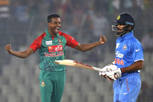 Bangladesh’s Al–Amin Hossain celebrates the wicket of India’s Shikhar Dhawan, right. (AP Photo) Bangladesh’s Al–Amin Hossain celebrates the wicket of India’s Shikhar Dhawan, right. (AP Photo)