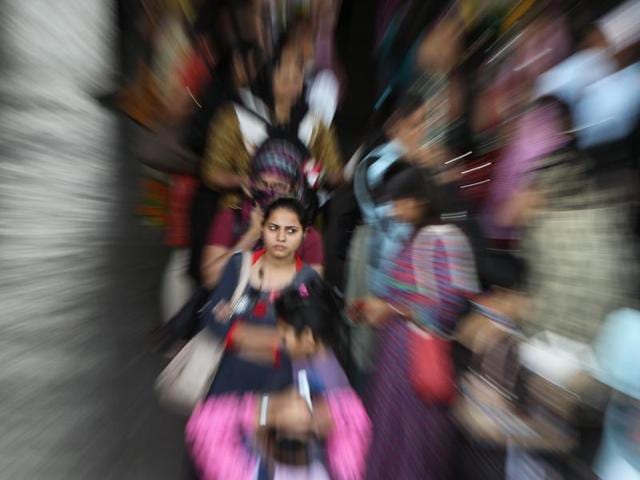 In focus: Women commuters wait for a local train at Bandra station in Mumbai.  (Satish Bate/HT Photo) 