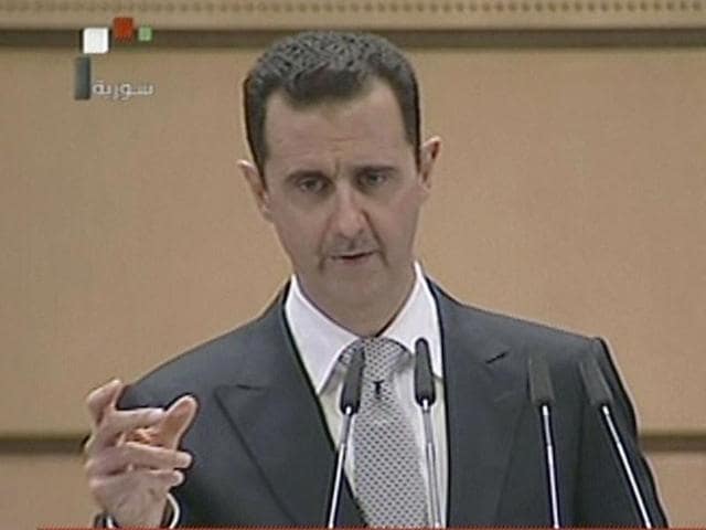 Civil defence members search for survivors after airstrikes by pro-Syrian government forces in Aleppo. The Syrian President has assured its Russian ally that it is ready to respect the proposed ceasefire.(REUTERS)